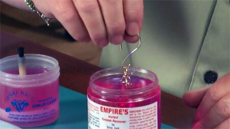 Metal being dipped into anti tarnish liquid